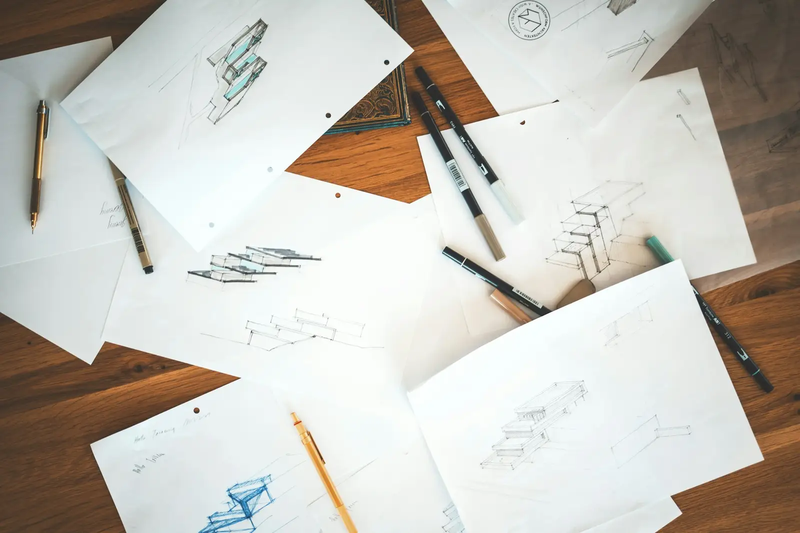 Architectural sketches on a wooden table