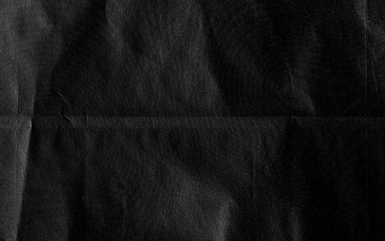 Folded charcoal paper with a tactile surface