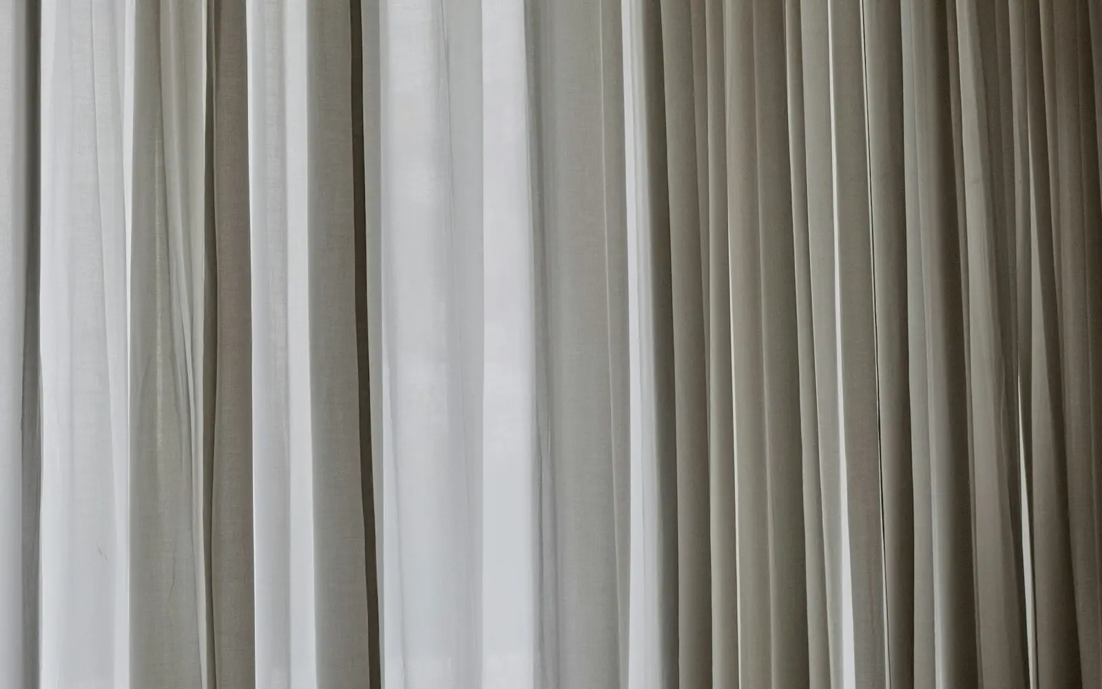 Bone-colored architectural folds in soft natural light